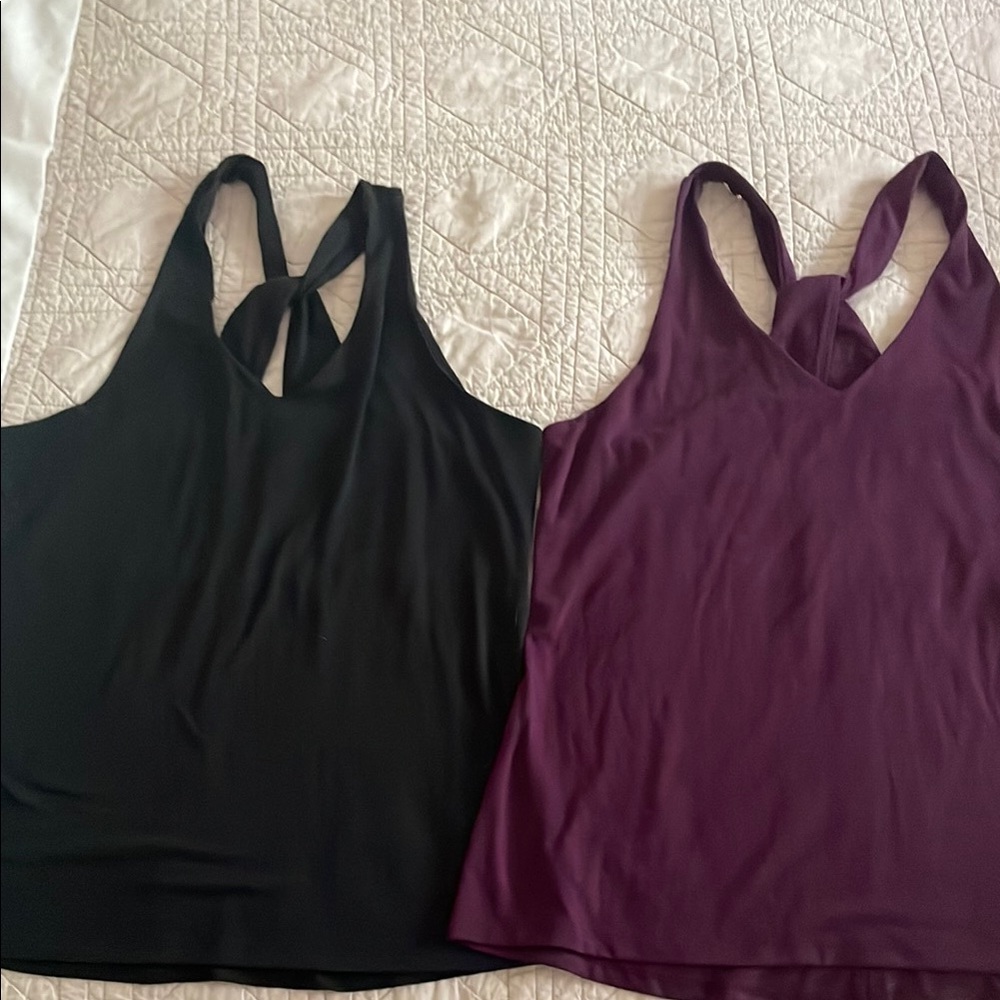Athleta V-neck tank tops, in Black xxs and Purple xs. Like new!